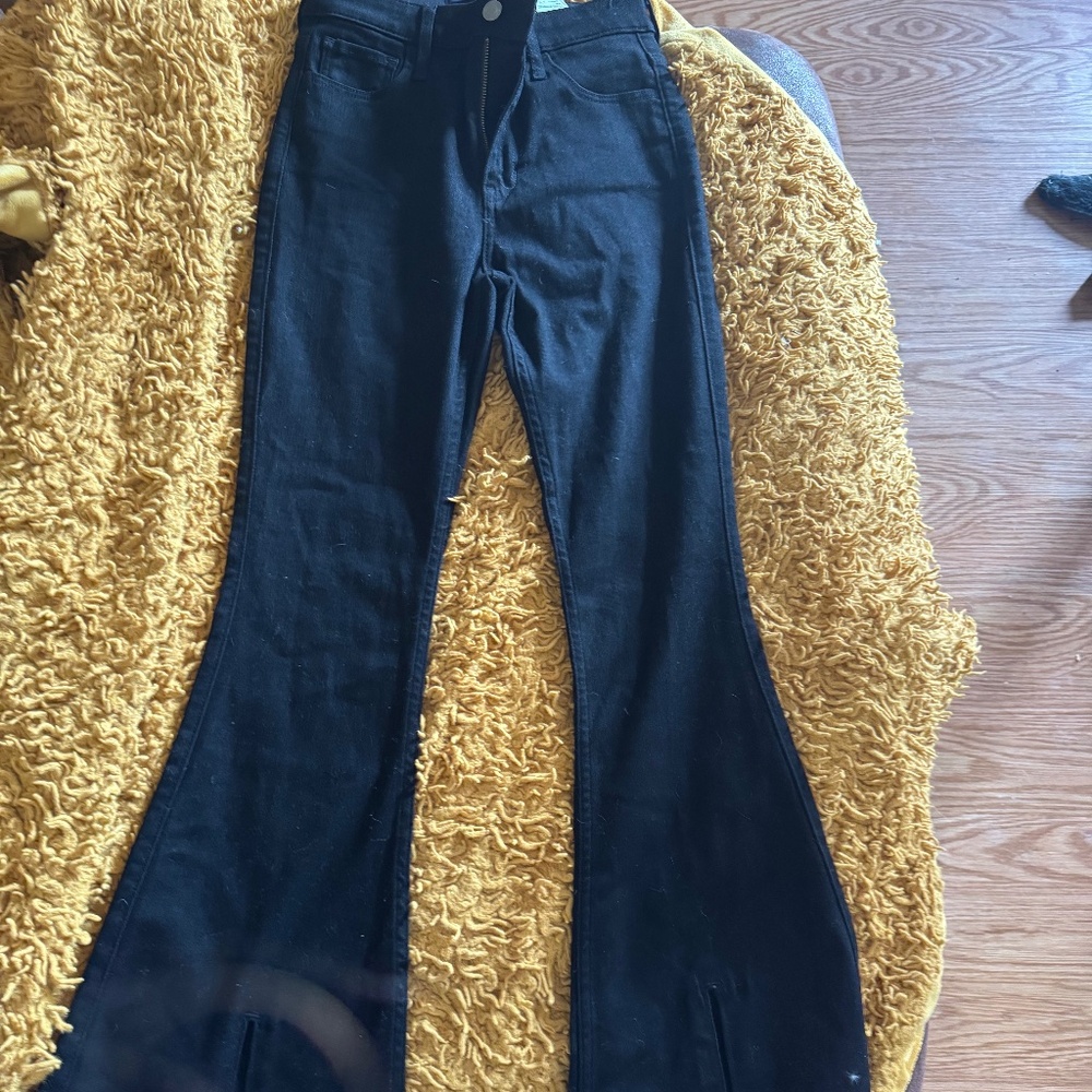 Black bootcut jeans with slits